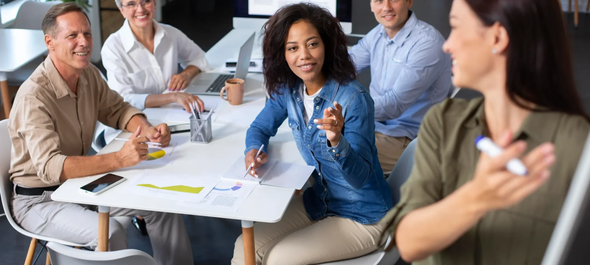 people-using-digital-device-while-meeting